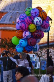 This beautiful lady is trying to sell her balloon. Located at Sultanahmet, Istanbul.